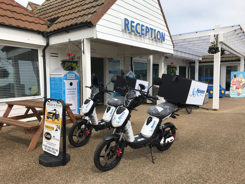 Two men on custom brand Haven Eskuta SX-250 Electric bikes